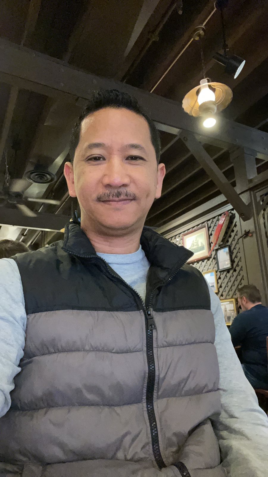 Portrait of James, master barber, at James Barber Shop and Salon